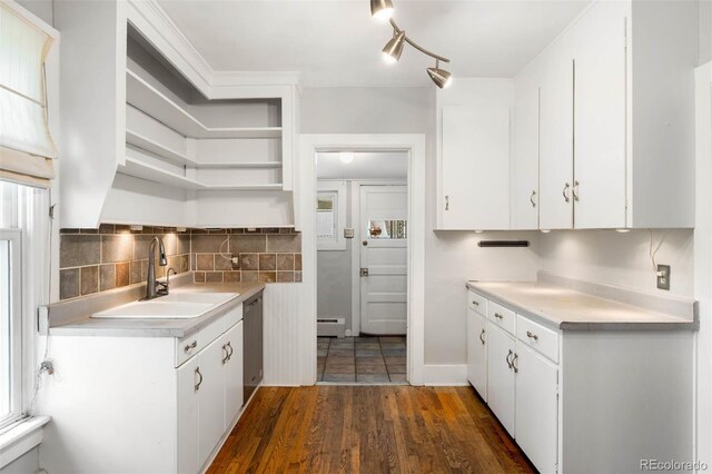 130 S Humboldt St, Denver, CO 80209 - kitchen featuring a sink, open shelves, dishwasher, a baseboard heating unit, and light countertops