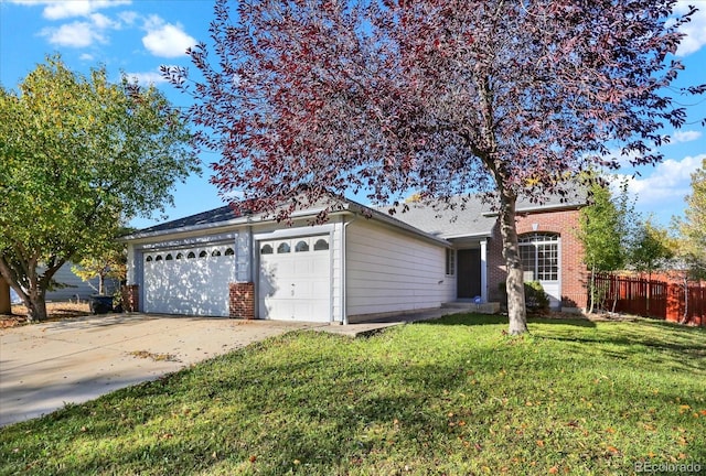 single story home with a front lawn and a garage