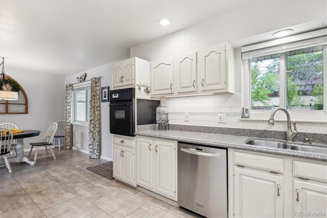 6410 Independence Way, Arvada, CO 80004 - kitchen featuring stainless steel dishwasher, a sink, black oven, white cabinets, and backsplash