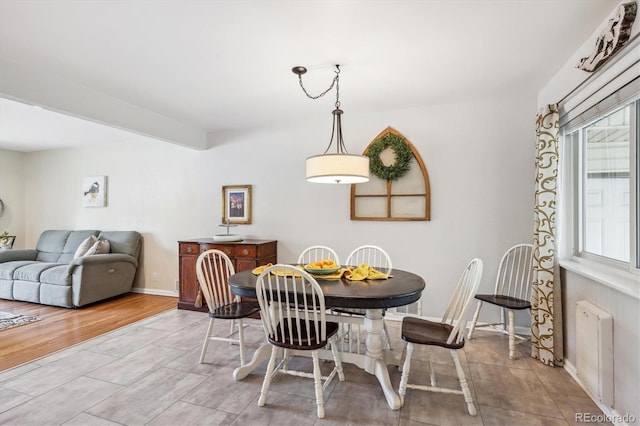 6410 Independence Way, Arvada, CO 80004 - dining space with plenty of natural light, radiator heating unit, and baseboards