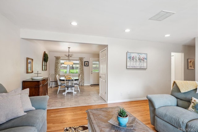 6410 Independence Way, Arvada, CO 80004 - living area featuring recessed lighting, light wood-style flooring, and baseboards