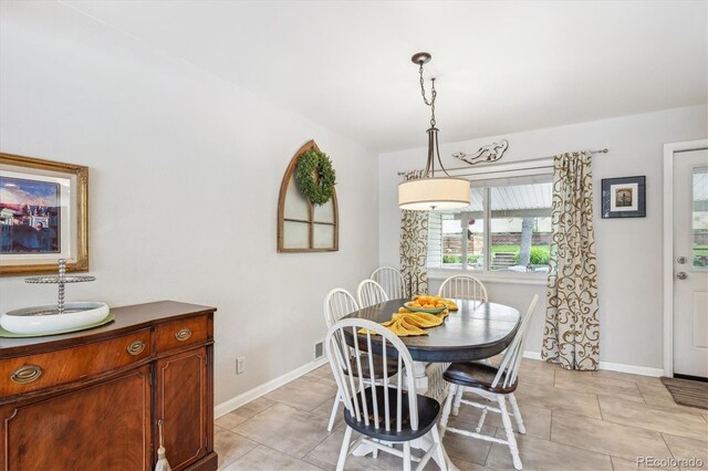 6410 Independence Way, Arvada, CO 80004 - dining area featuring baseboards and light tile patterned floors