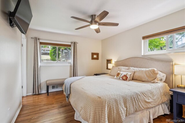 6410 Independence Way, Arvada, CO 80004 - bedroom featuring wood finished floors, baseboards, and ceiling fan
