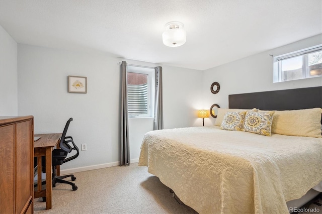 6410 Independence Way, Arvada, CO 80004 - bedroom featuring light colored carpet, baseboards, and an office area