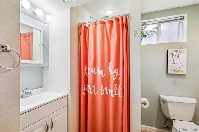 6410 Independence Way, Arvada, CO 80004 - full bathroom featuring vanity, toilet, and curtained shower