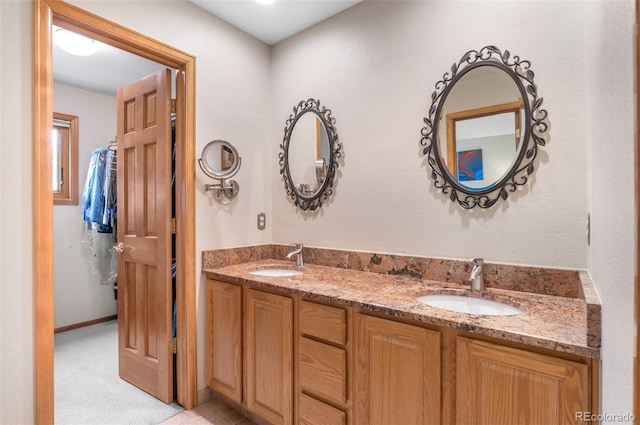 full bath with a sink and double vanity