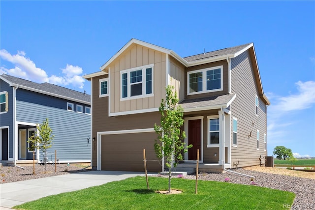 737 Muturu Rd, Johnstown, CO 80534 - view of front of property featuring concrete driveway, a garage, central air condition unit, board and batten siding, and a front lawn