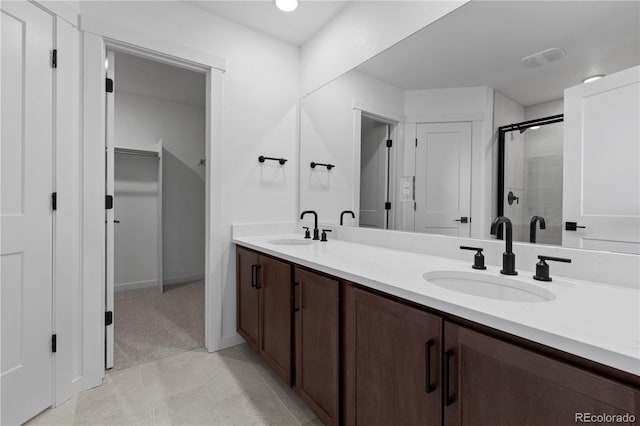 737 Muturu Rd, Johnstown, CO 80534 - bathroom with double vanity, a shower stall, and a spacious closet