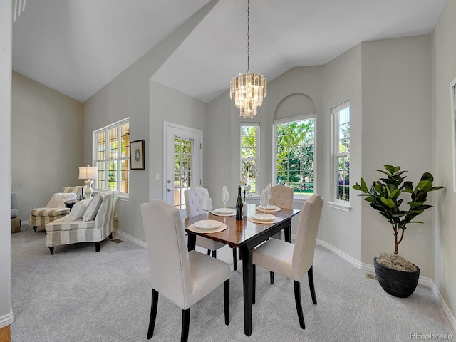 946 Champion Cir, Longmont, CO 80503 - dining room featuring baseboards, lofted ceiling, carpet floors, and a chandelier