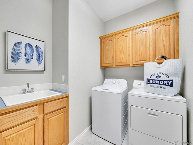 946 Champion Cir, Longmont, CO 80503 - laundry area with cabinet space, washing machine and clothes dryer, and baseboards
