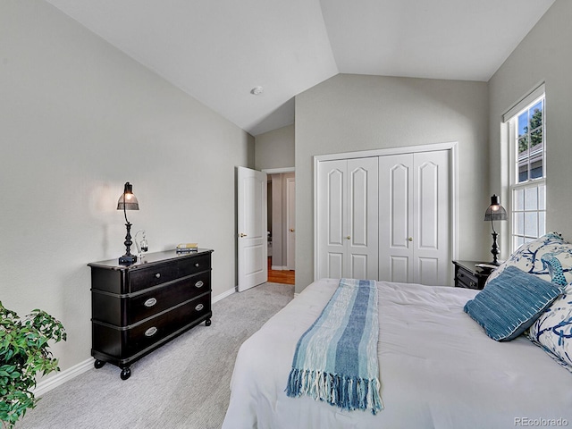 946 Champion Cir, Longmont, CO 80503 - bedroom featuring carpet, baseboards, vaulted ceiling, and a closet