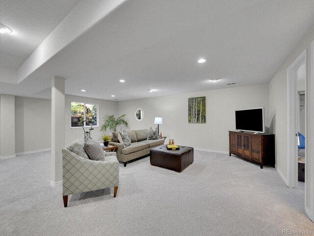 946 Champion Cir, Longmont, CO 80503 - living area with light colored carpet, baseboards, and recessed lighting