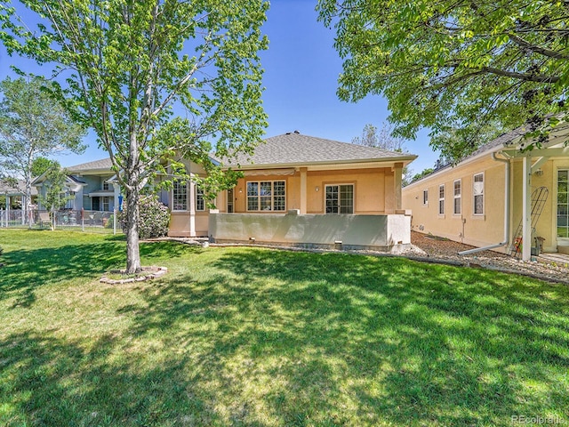 946 Champion Cir, Longmont, CO 80503 - rear view of house featuring stucco siding and a shingled roof