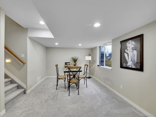 946 Champion Cir, Longmont, CO 80503 - dining area with carpet, recessed lighting, baseboards, and stairway