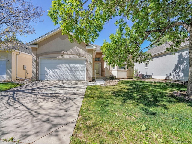 946 Champion Cir, Longmont, CO 80503 - view of front of house featuring stucco siding, an attached garage, concrete driveway, and a front lawn
