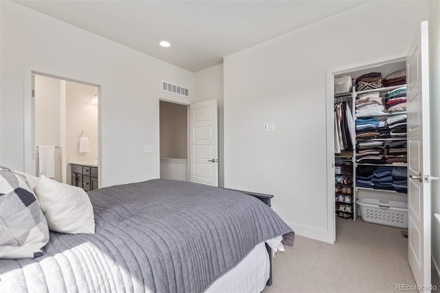 2080 Alcott Way, Broomfield, CO 80023 - bedroom featuring a spacious closet, a closet, light carpet, ensuite bath, and recessed lighting