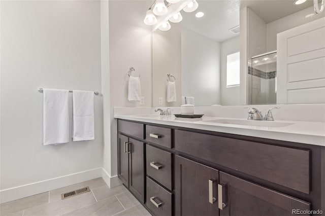 2080 Alcott Way, Broomfield, CO 80023 - bathroom with double vanity, a shower stall, baseboards, and tile patterned floors