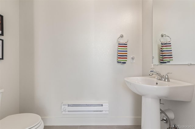 2080 Alcott Way, Broomfield, CO 80023 - bathroom featuring toilet, a baseboard radiator, and baseboards