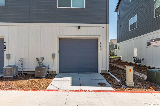 2080 Alcott Way, Broomfield, CO 80023 - garage featuring cooling unit and driveway