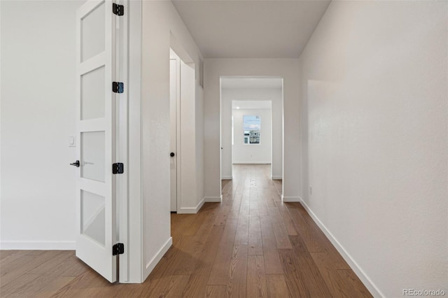 corridor featuring light wood-type flooring