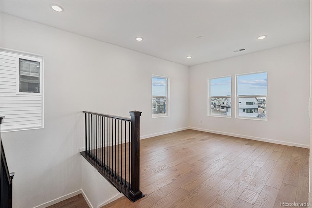 unfurnished room featuring hardwood / wood-style floors