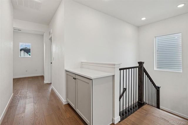 hallway with wood-type flooring