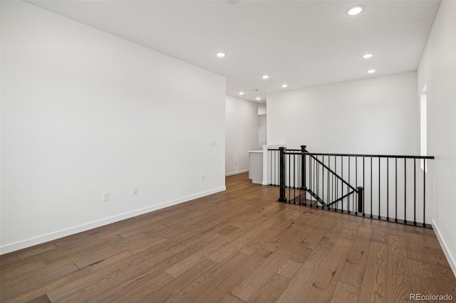 empty room with wood-type flooring