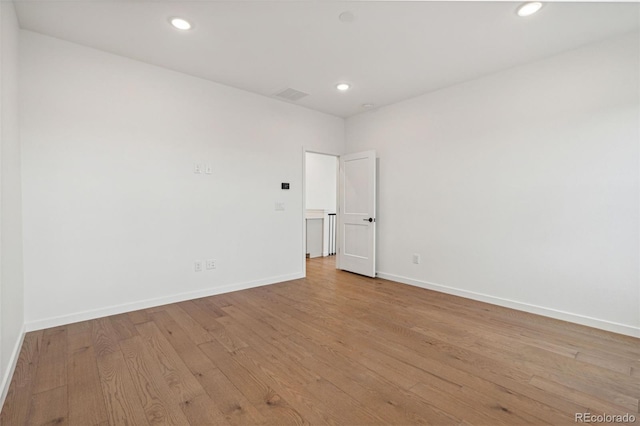 spare room featuring light wood-type flooring