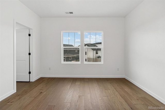 unfurnished room featuring light wood-type flooring