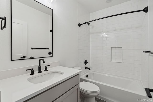 full bathroom featuring vanity, toilet, and tiled shower / bath