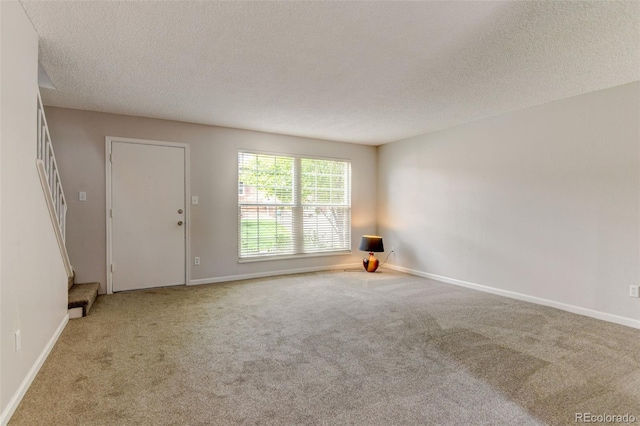 3855 S Monaco St Unit 177, Denver, CO 80237 - carpeted spare room with a textured ceiling and baseboards