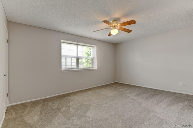 3855 S Monaco St Unit 177, Denver, CO 80237 - unfurnished room with carpet, a textured ceiling, a ceiling fan, and baseboards