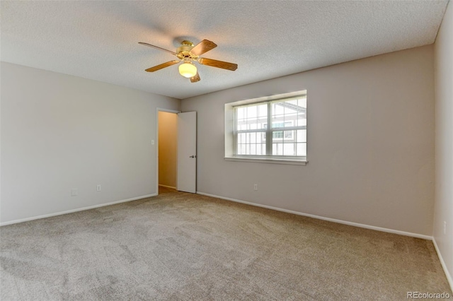 3855 S Monaco St Unit 177, Denver, CO 80237 - carpeted spare room featuring a ceiling fan, baseboards, and a textured ceiling