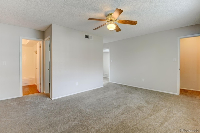 3855 S Monaco St Unit 177, Denver, CO 80237 - carpeted empty room featuring a ceiling fan, a textured ceiling, and baseboards