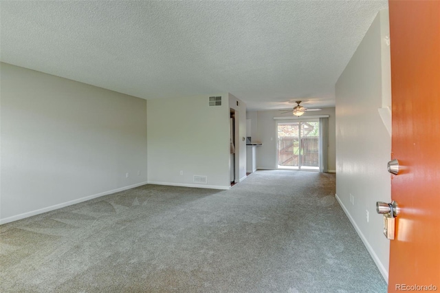 3855 S Monaco St Unit 177, Denver, CO 80237 - unfurnished living room featuring carpet floors, a textured ceiling, ceiling fan, and baseboards