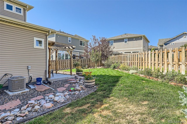 view of yard featuring a pergola and central AC