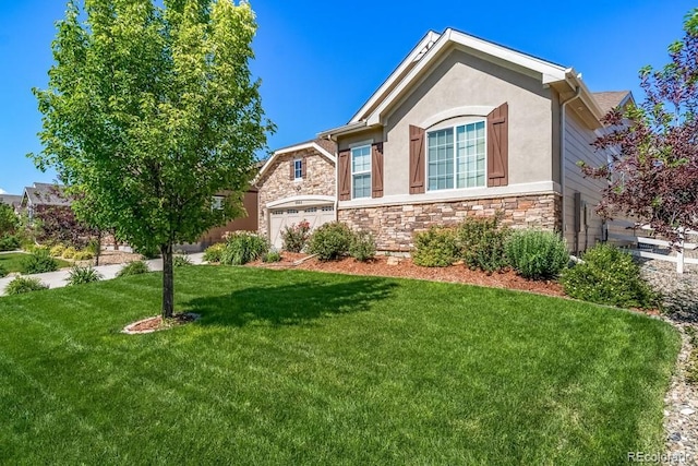 5865 Clover Ridge Cir, Castle Rock, CO 80104 - view of front of house with stone siding, a front yard, and stucco siding