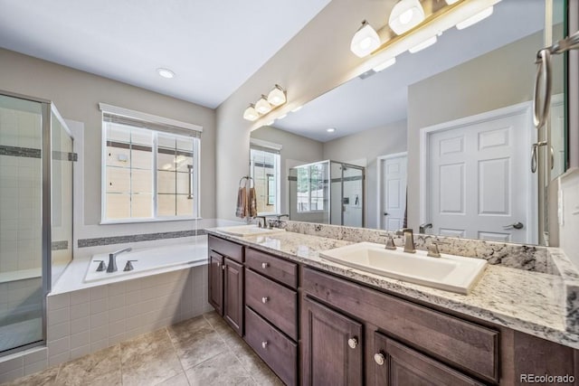 5865 Clover Ridge Cir, Castle Rock, CO 80104 - full bath with a stall shower, double vanity, a garden tub, and tile patterned floors