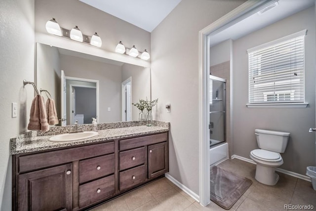 5865 Clover Ridge Cir, Castle Rock, CO 80104 - full bathroom featuring vanity, tile patterned flooring, and bath / shower combo with glass door