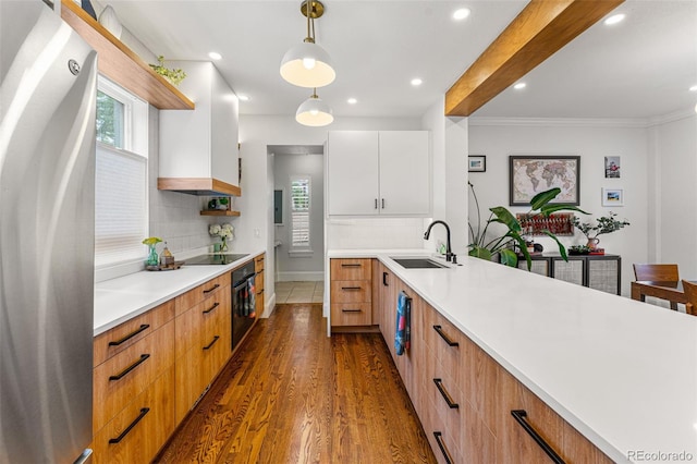 kitchen featuring open shelves, dark wood-style flooring, a sink, light countertops, and black appliances