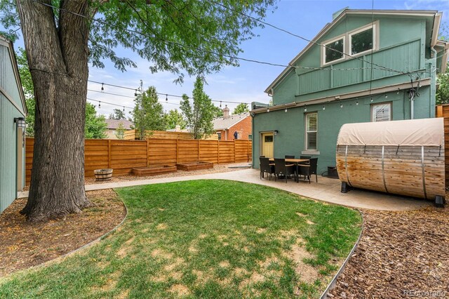 view of yard featuring a patio area and a fenced backyard