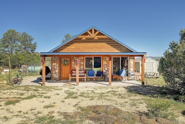 exterior space with a patio and a storage unit