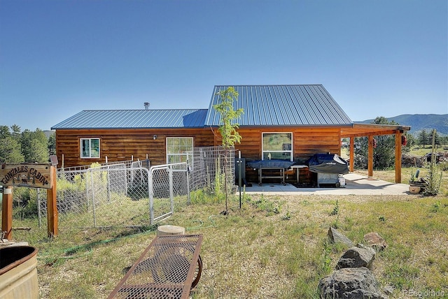 back of property featuring a patio area and an outdoor living space