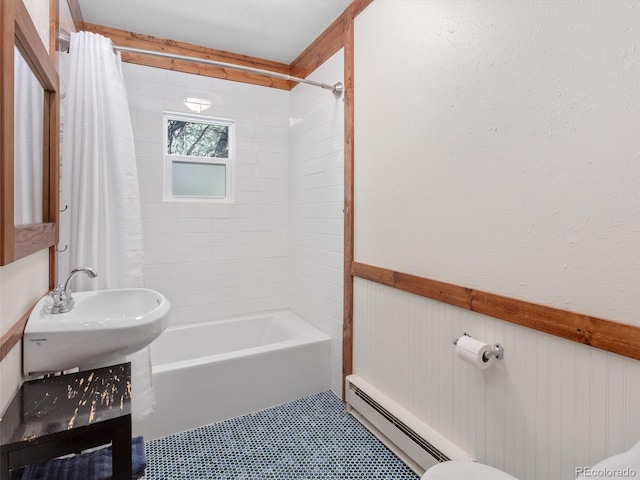 274 N Willow St, Crestone, CO 81131 - full bathroom featuring a baseboard heating unit, shower / bath combination with curtain, a wainscoted wall, and vanity