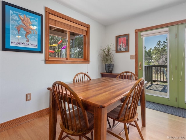 274 N Willow St, Crestone, CO 81131 - dining room with light wood-style flooring and healthy amount of natural light