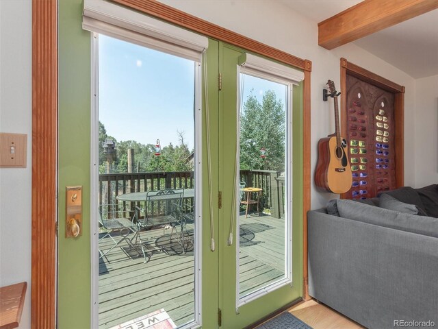 274 N Willow St, Crestone, CO 81131 - doorway featuring beamed ceiling and wood finished floors