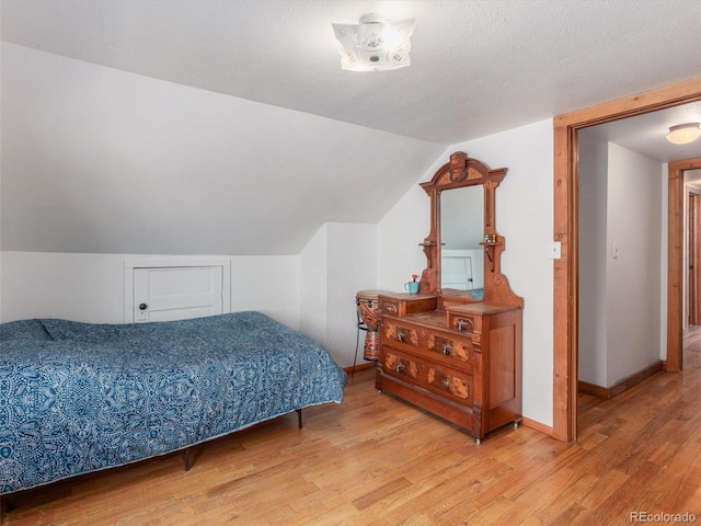 274 N Willow St, Crestone, CO 81131 - bedroom with wood finished floors and vaulted ceiling