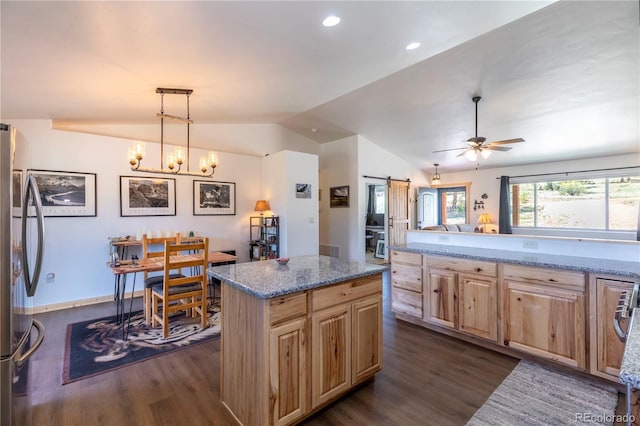 874 Hackamore Dr, Florissant, CO 80816 - kitchen featuring stainless steel fridge, dark wood-style flooring, lofted ceiling, light brown cabinetry, and light stone counters