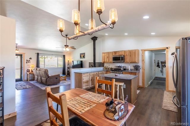 874 Hackamore Dr, Florissant, CO 80816 - dining area featuring lofted ceiling, dark wood-style flooring, ceiling fan, recessed lighting, and a chandelier