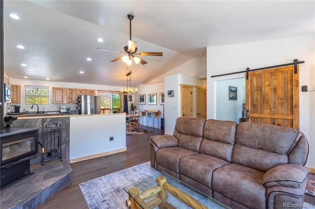 874 Hackamore Dr, Florissant, CO 80816 - living area with vaulted ceiling, dark wood finished floors, recessed lighting, a ceiling fan, and a barn door
